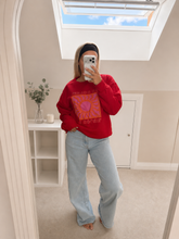 Load image into Gallery viewer, Clement - Oversized bright orange sun print jumper
